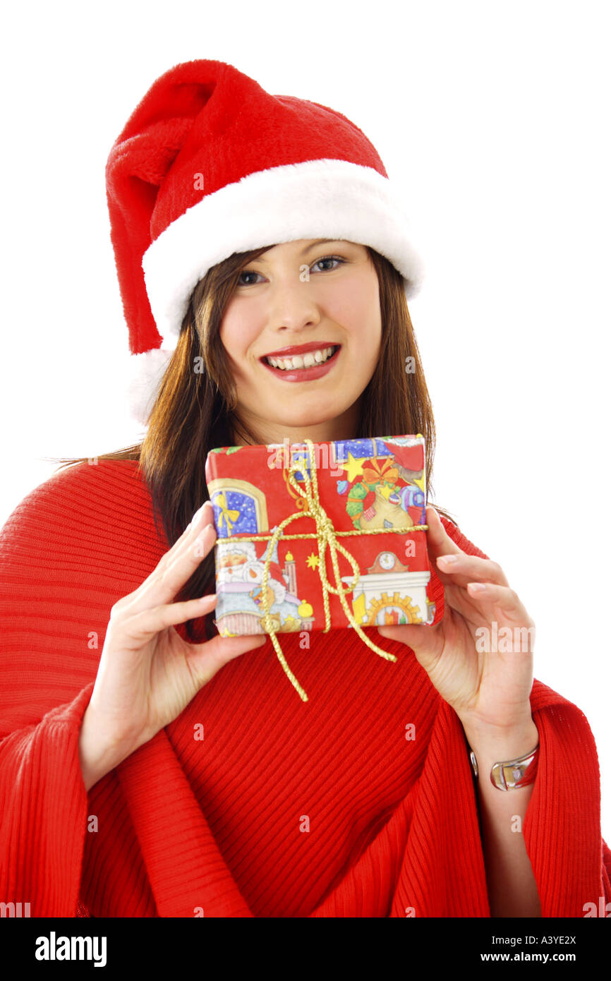 Jeune femme avec chapeau de Père Noël holding a Christmas present Banque D'Images