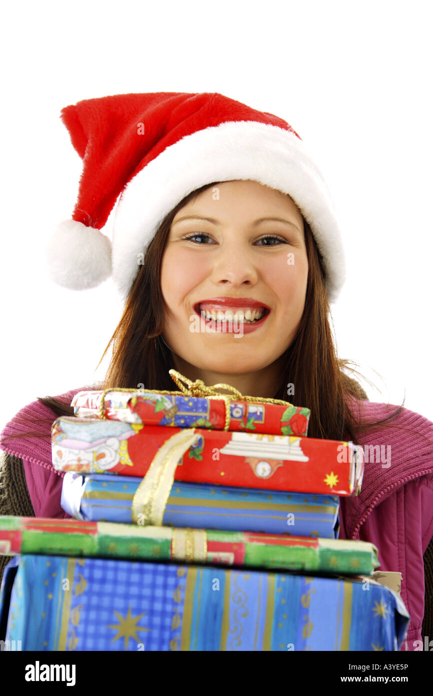 Jeune femme avec un chapeau de Père Noël cadeaux de Noël Banque D'Images