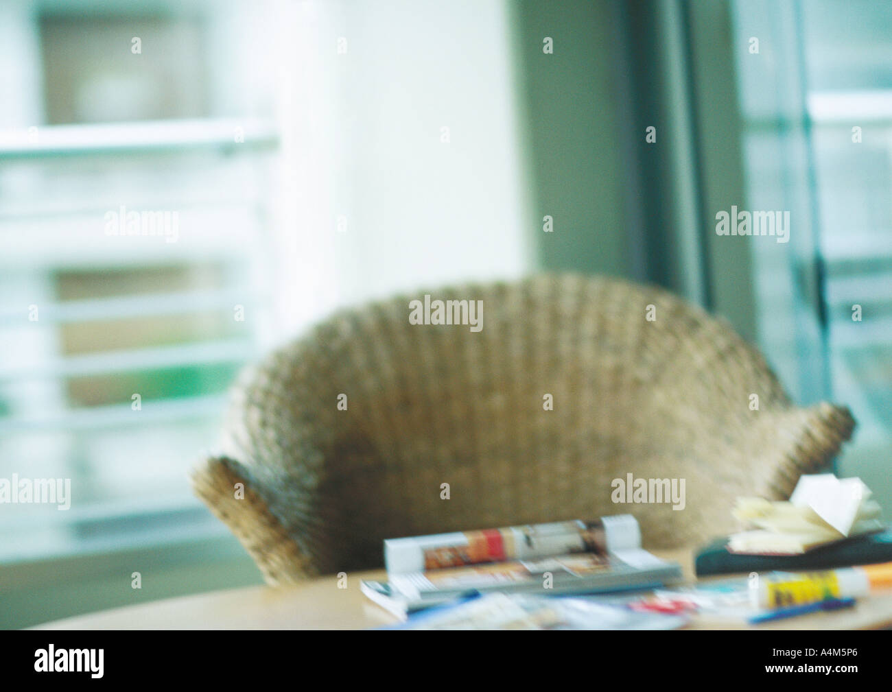 Wicker Chair at desk Banque D'Images