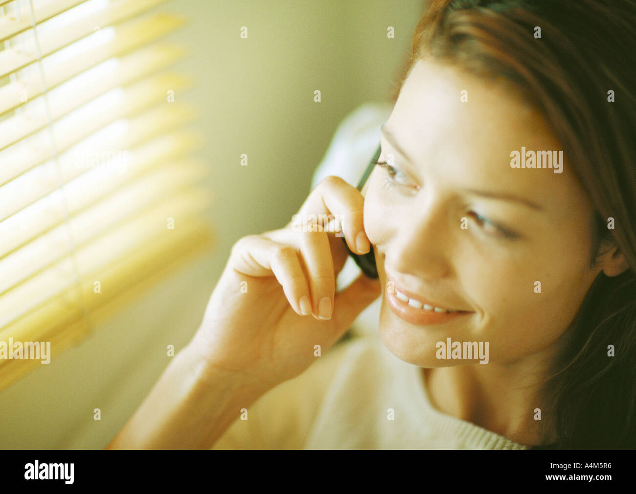 Woman, looking out window, close-up Banque D'Images