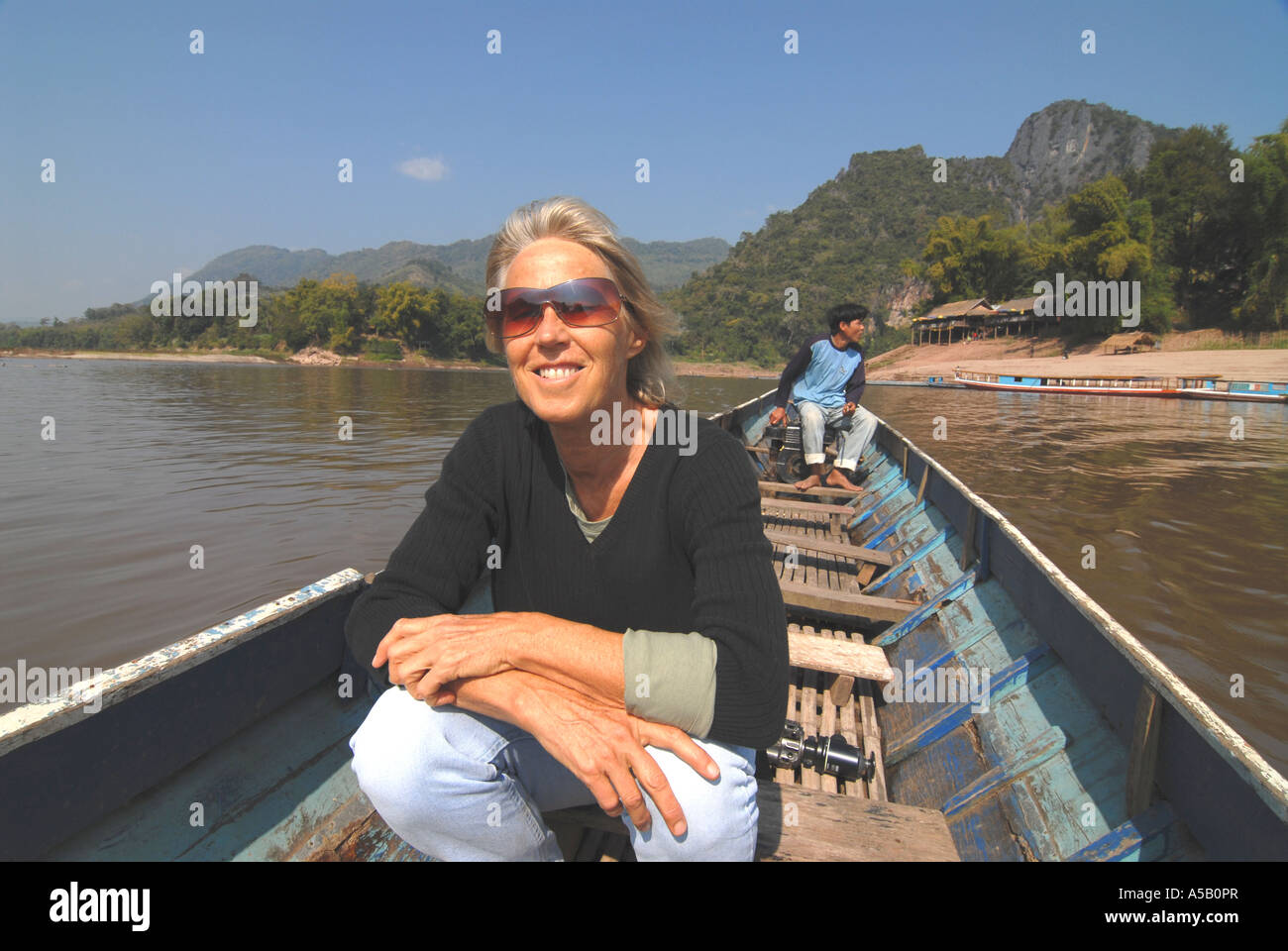 Heureux d'être sur le Mékong au Laos Banque D'Images