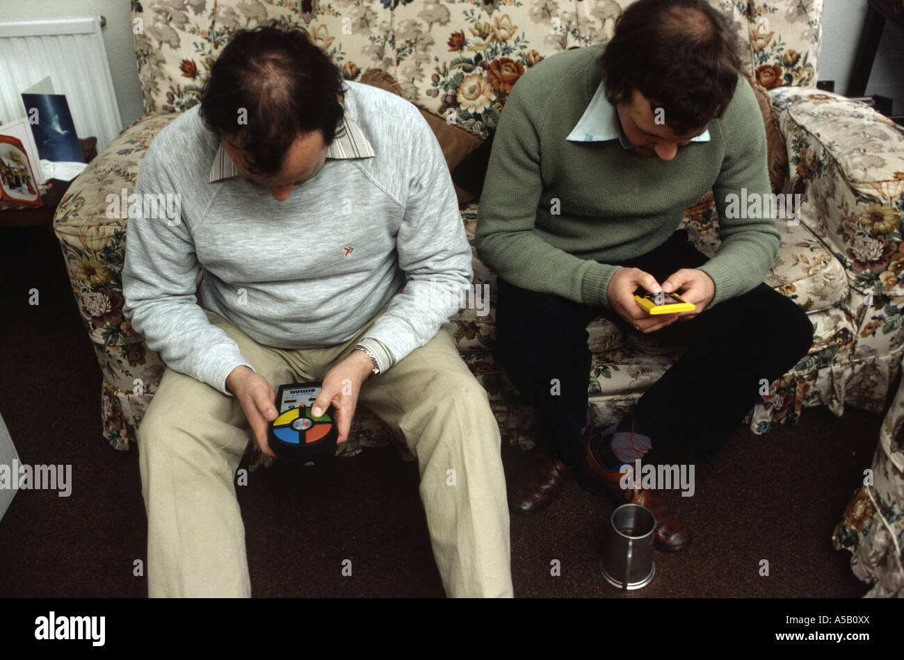 Balding Men playing computer games Banque D'Images