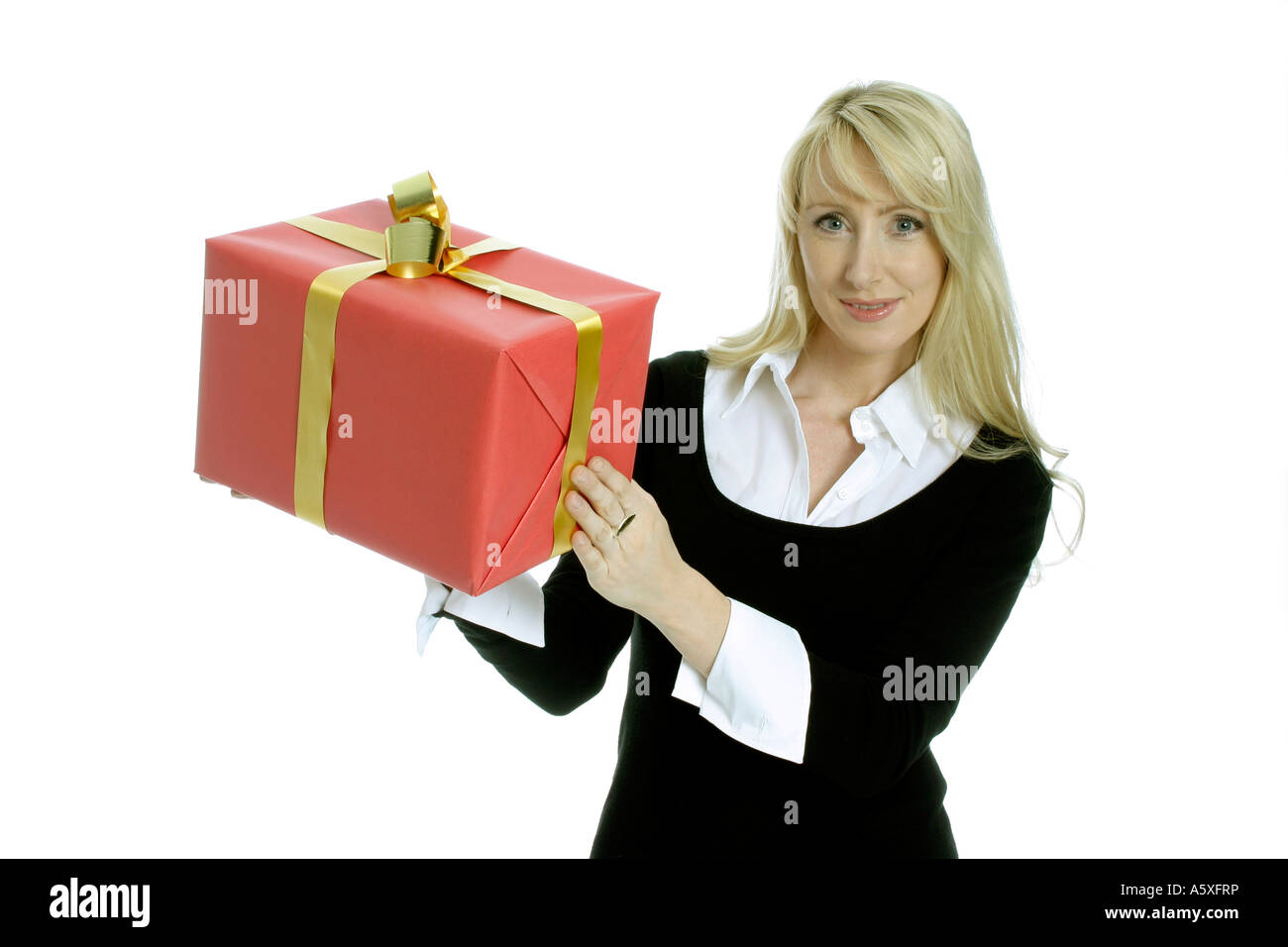 Mid adult woman holding Christmas Gift close up portrait Banque D'Images