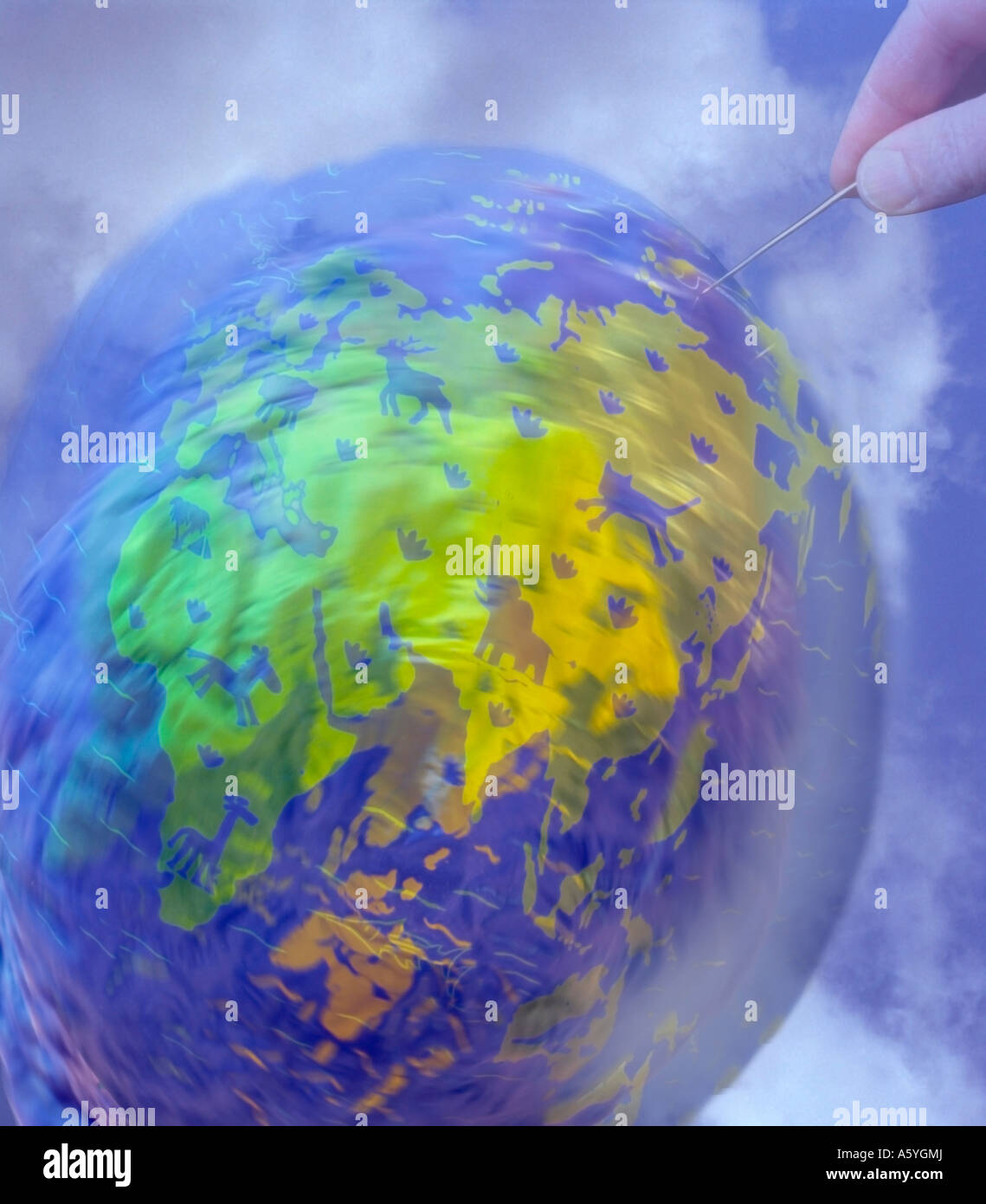 L'homme détruit la terre la main avec une aiguille, piquer en terrestial  globe Photo Stock - Alamy