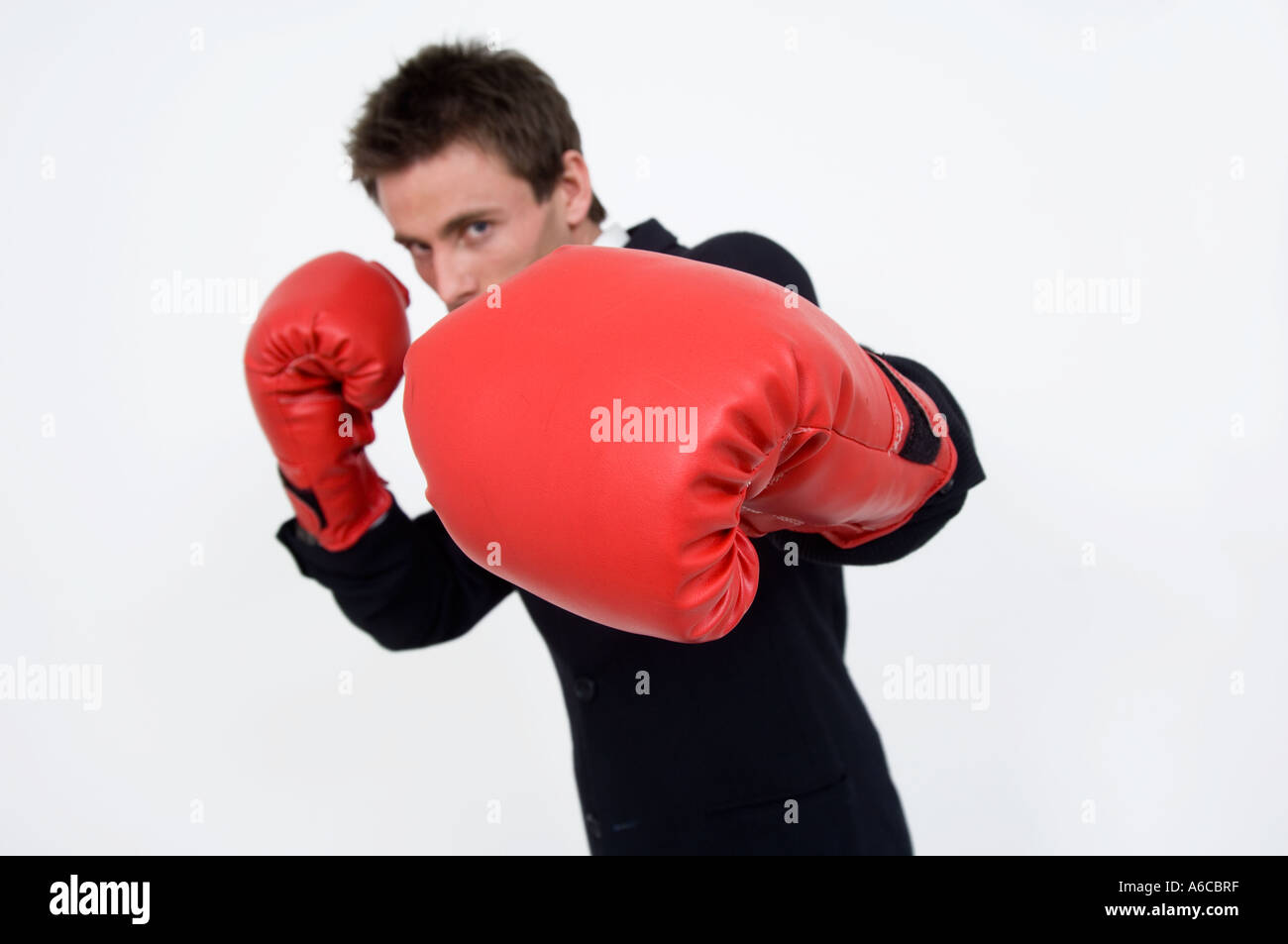 Businessman avec des gants de boxe Boxing clever la gestion de la colère Banque D'Images