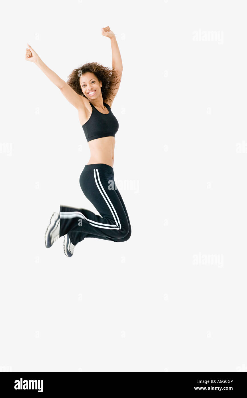 Woman jumping for joy Banque D'Images