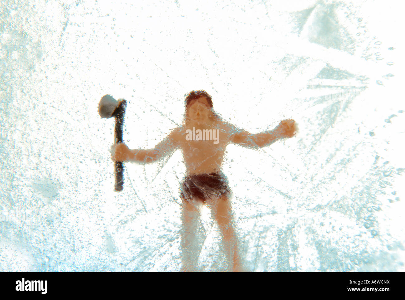 Caveman jouet congelé Banque D'Images