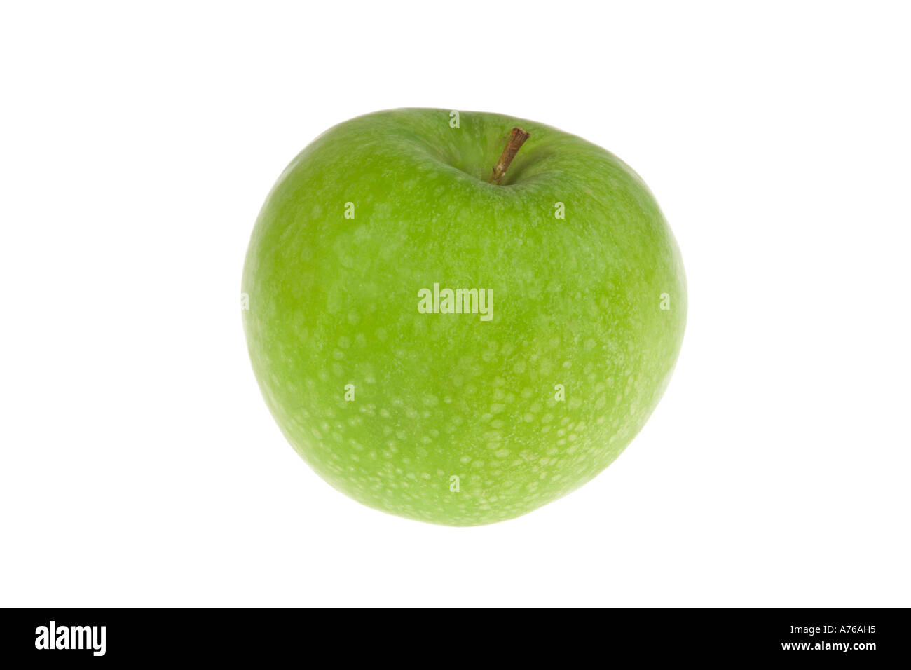 Toute une pomme verte sur un fond blanc, pur. Banque D'Images