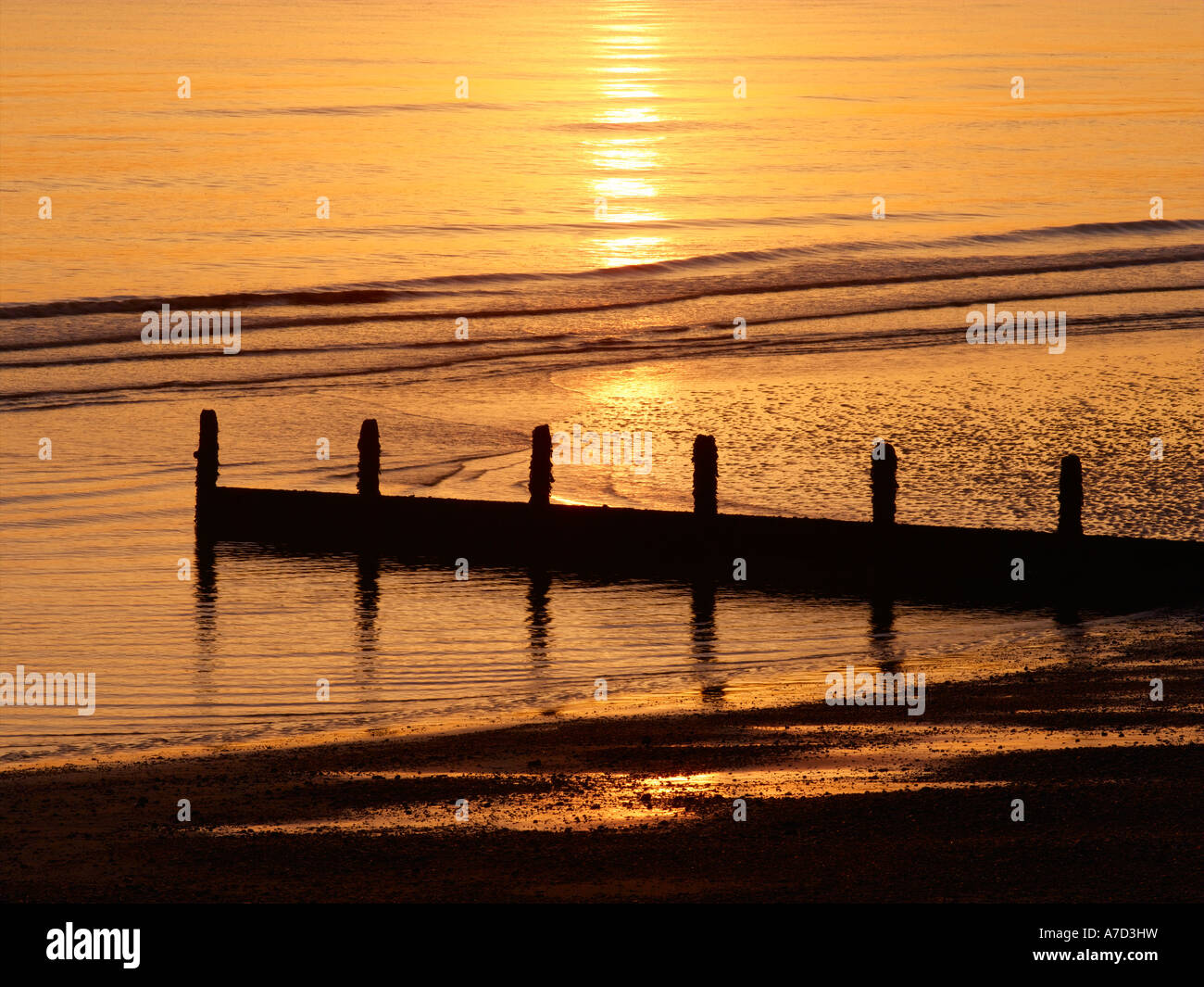 Épis, Camber Sands au coucher du soleil Banque D'Images