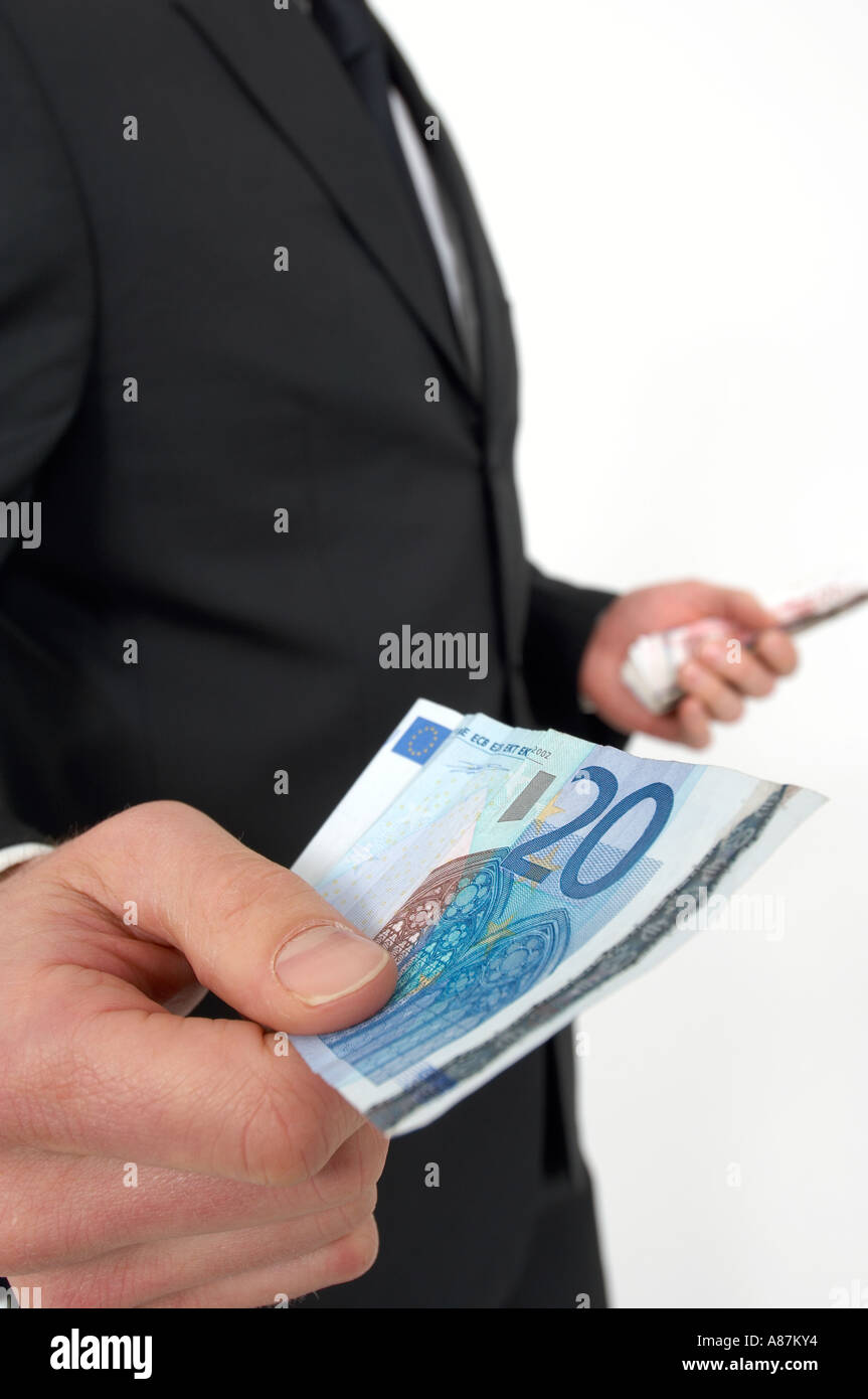 L'argent dans les mains du mans Rob Wilkinson 07836546556 Banque D'Images
