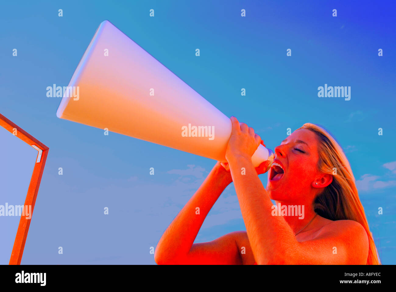 Girl yelling through megaphone Banque D'Images
