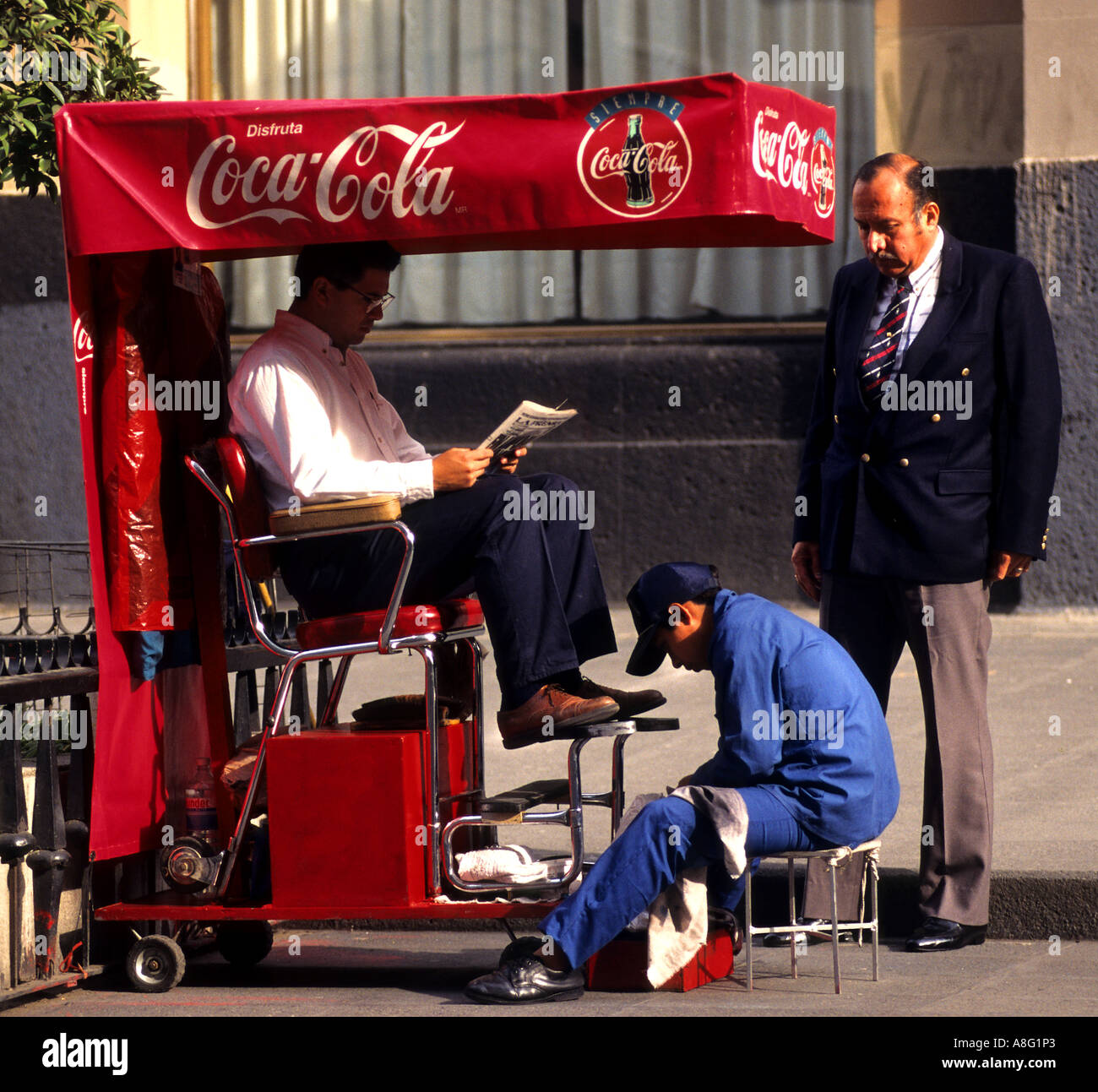 Coca Cola service de cireur garçon shoeshiner Mexico City Banque D'Images