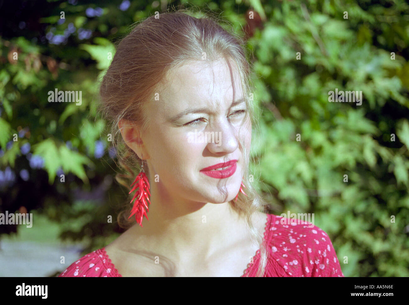 Portrait young girl in red Banque D'Images