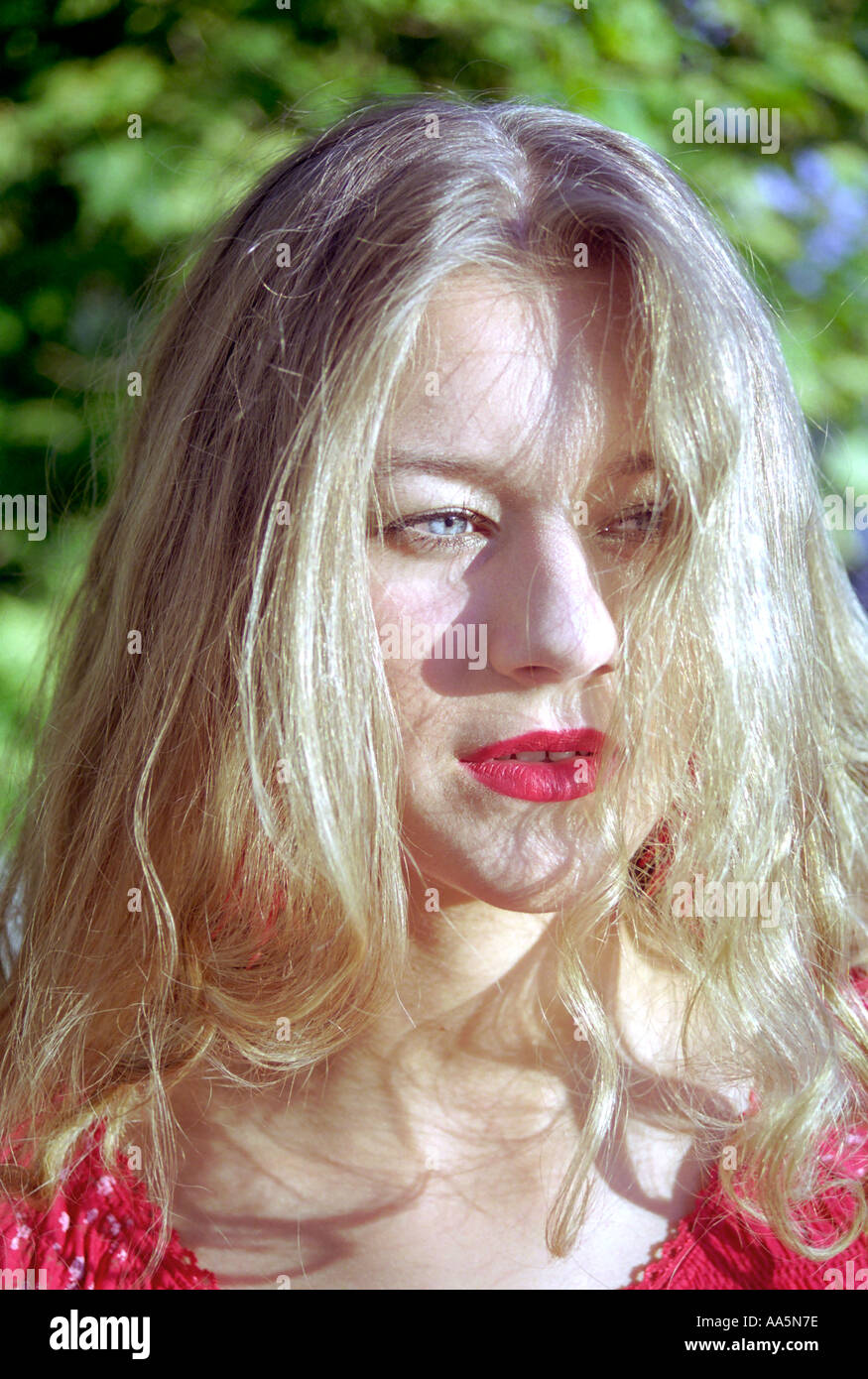 Portrait young girl in red Banque D'Images