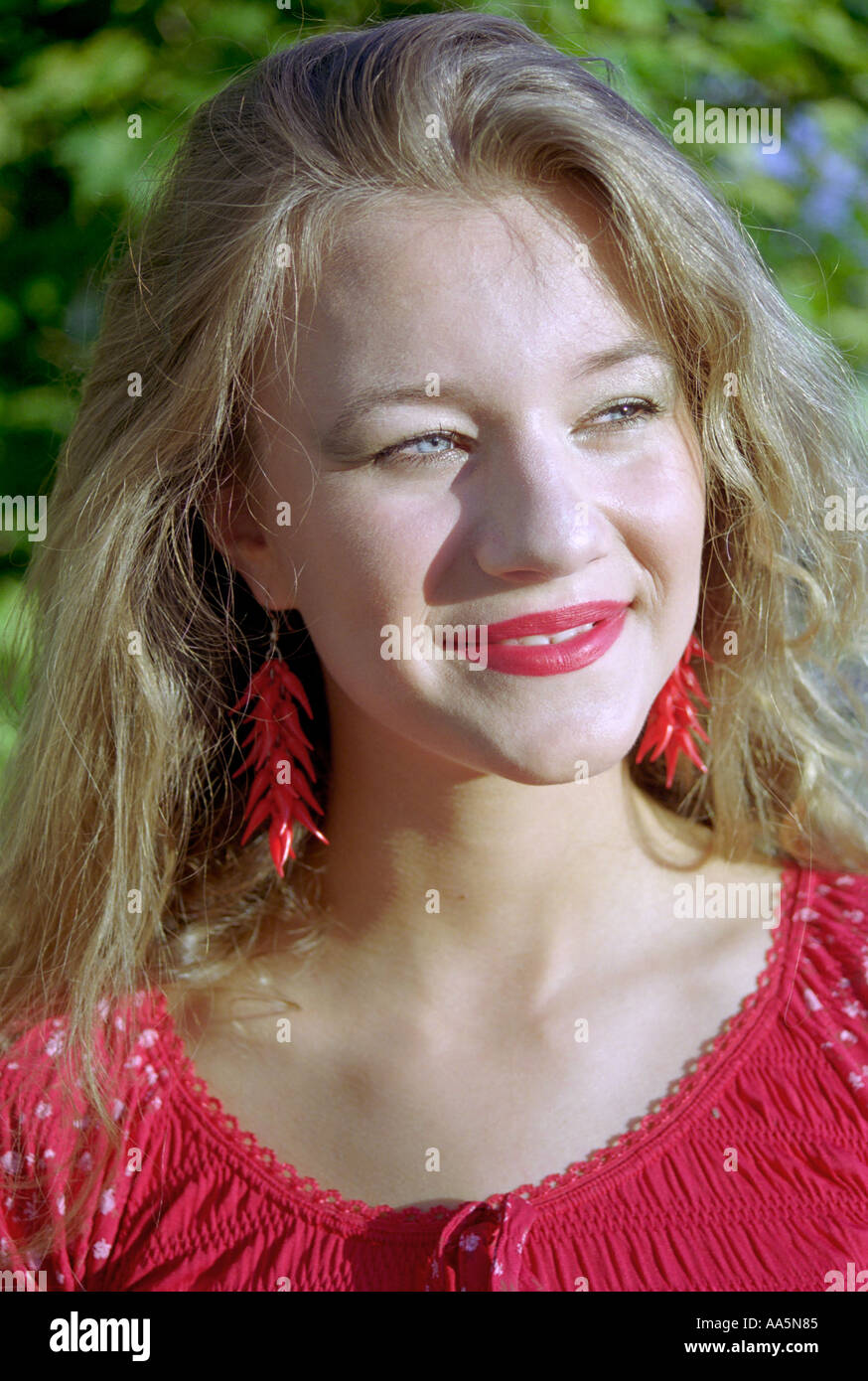 Portrait young girl in red Banque D'Images