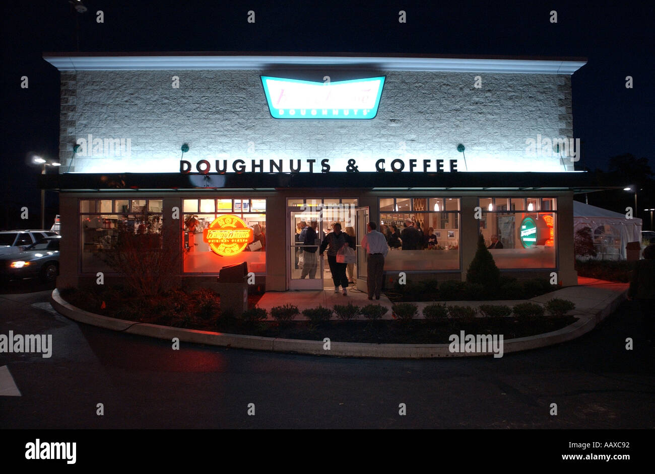 Krispy Kreme la chaîne avec la marque signe rouge maintenant sex donuts Banque D'Images