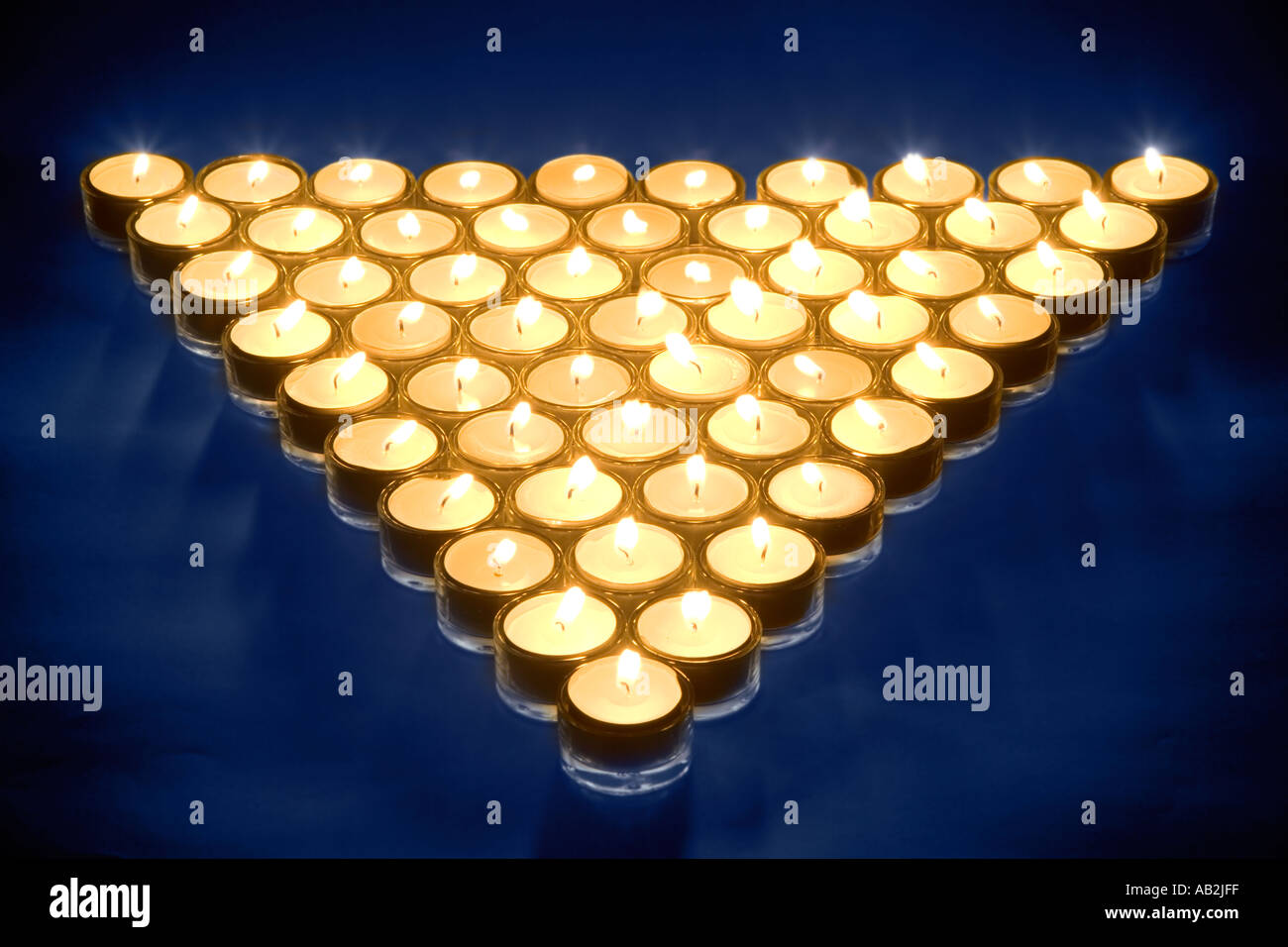 Triangle de l'allumé des bougies Banque D'Images