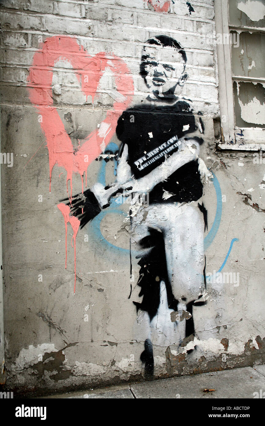 Pochoir de Banksy peinture garçon cœur, Islington, Londres Banque D'Images