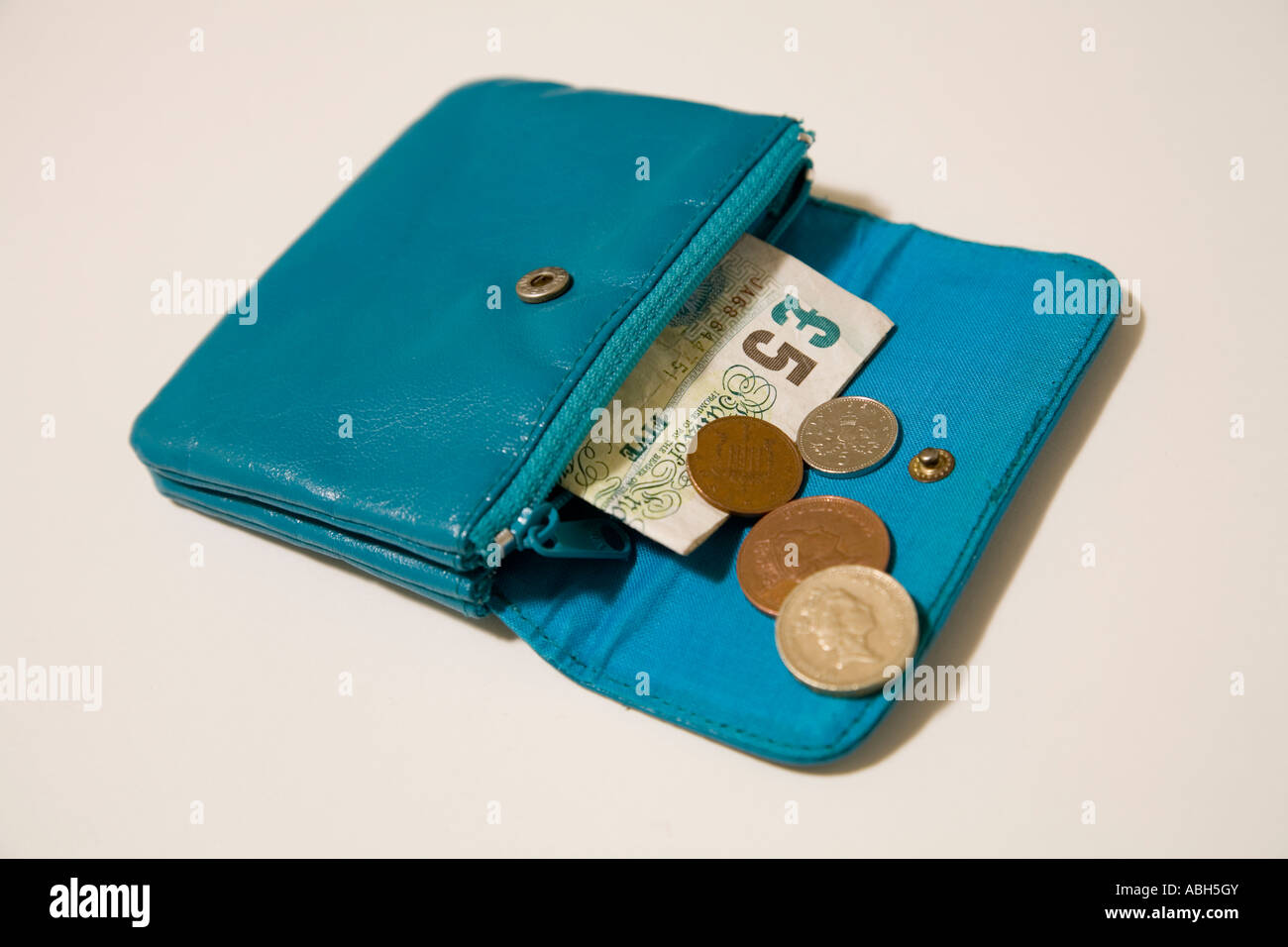 Sac à main en cuir bleu, 5 lb, et petit changement Banque D'Images
