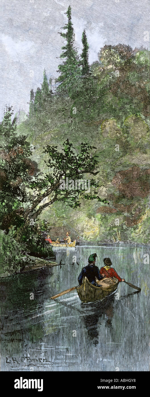 Les commerçants de fourrures français canoë sur une rivière dans les forêts de l'Amérique du Nord. À la main, gravure sur bois Banque D'Images