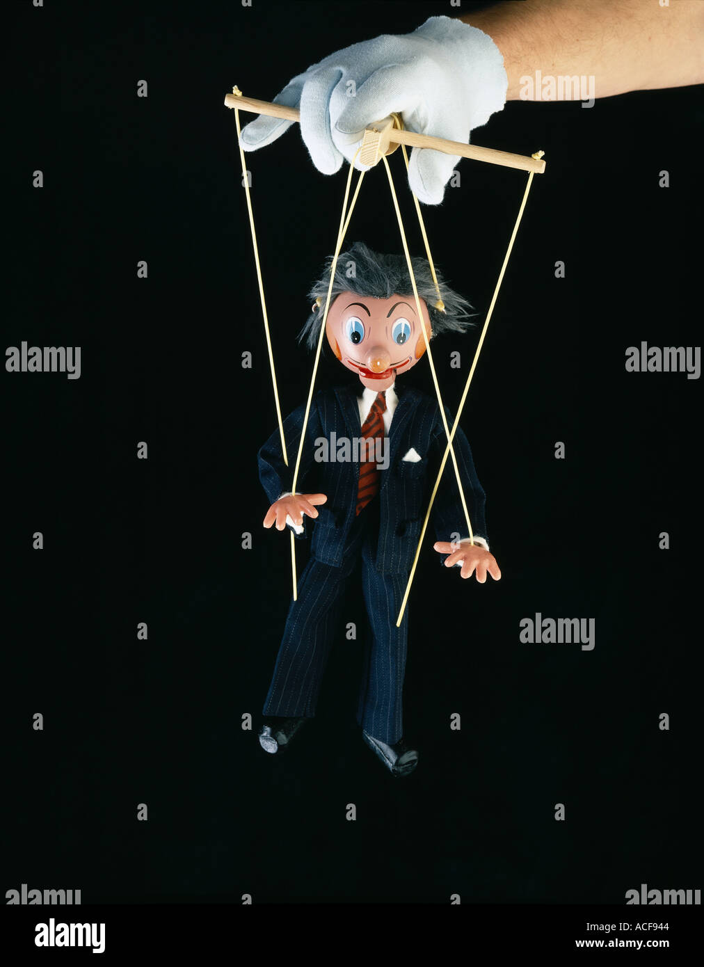 Businessman en costume puppet exploités par un marionnettiste Banque D'Images
