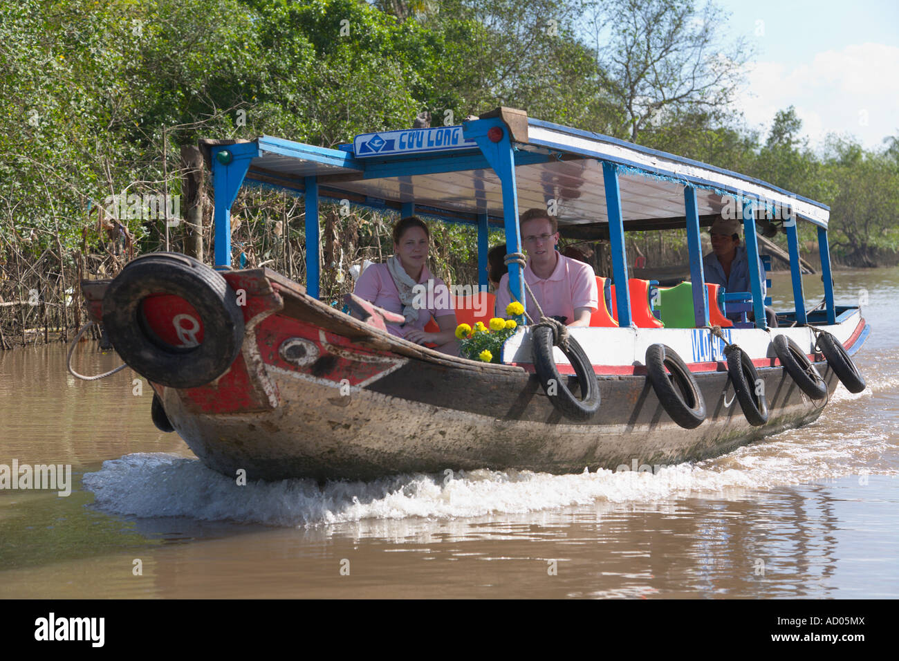Couple sur un bateau de tourisme [Delta du Mékong] 'Ha Giang Province' Vietnam Banque D'Images