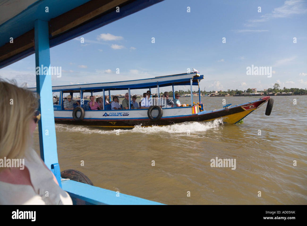 Les touristes sur un bateau [Delta du Mékong] 'Ha Giang Province' Vietnam Banque D'Images