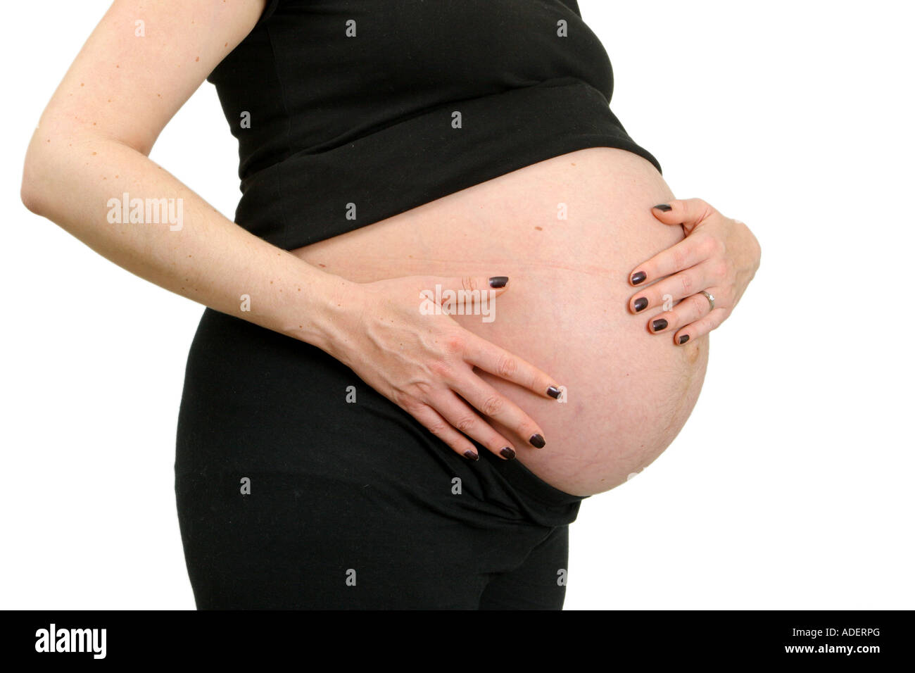 Femme enceinte de profil sentiment abdomen Photo Stock - Alamy