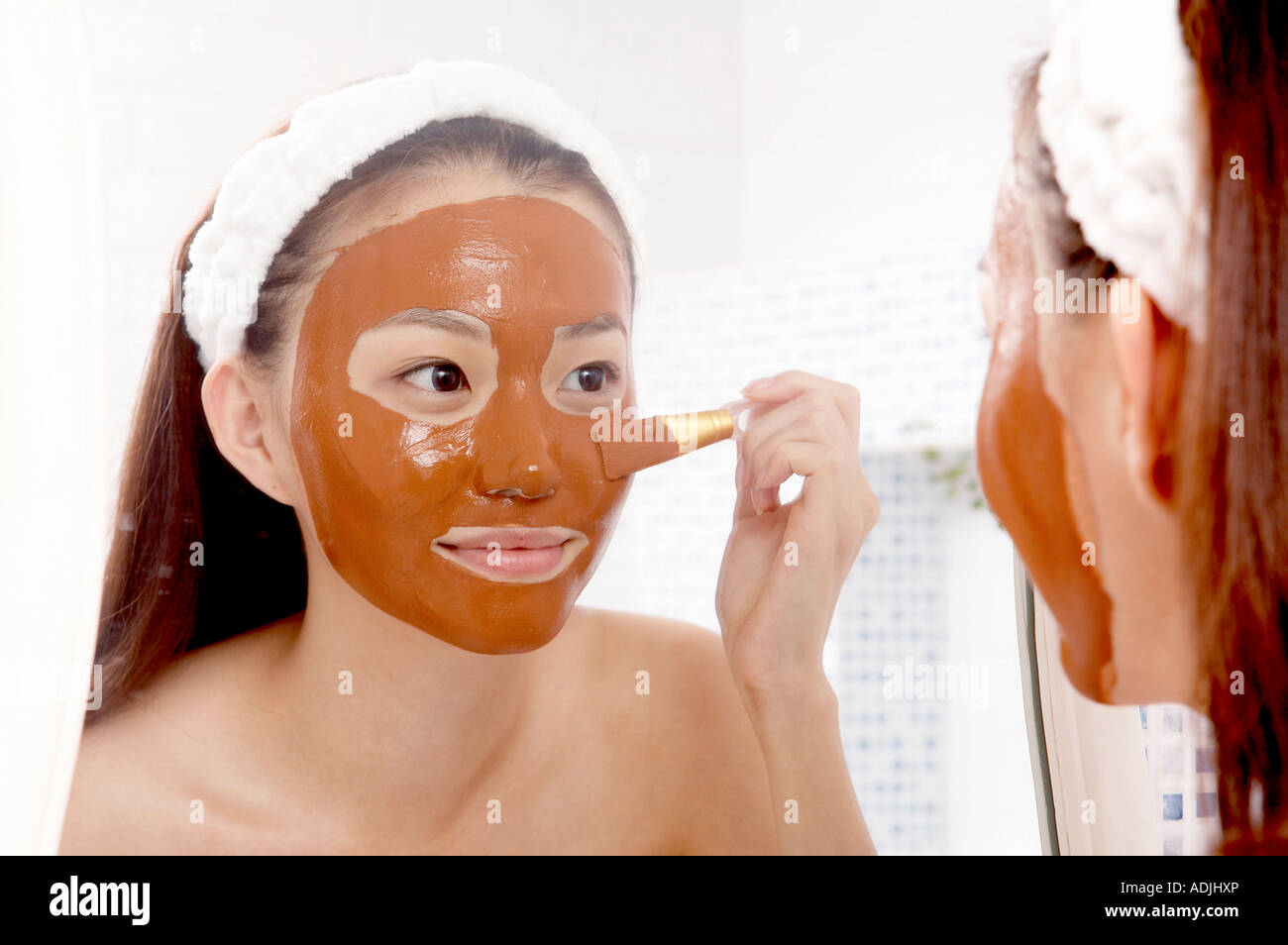 Femme pack de boue Banque D'Images