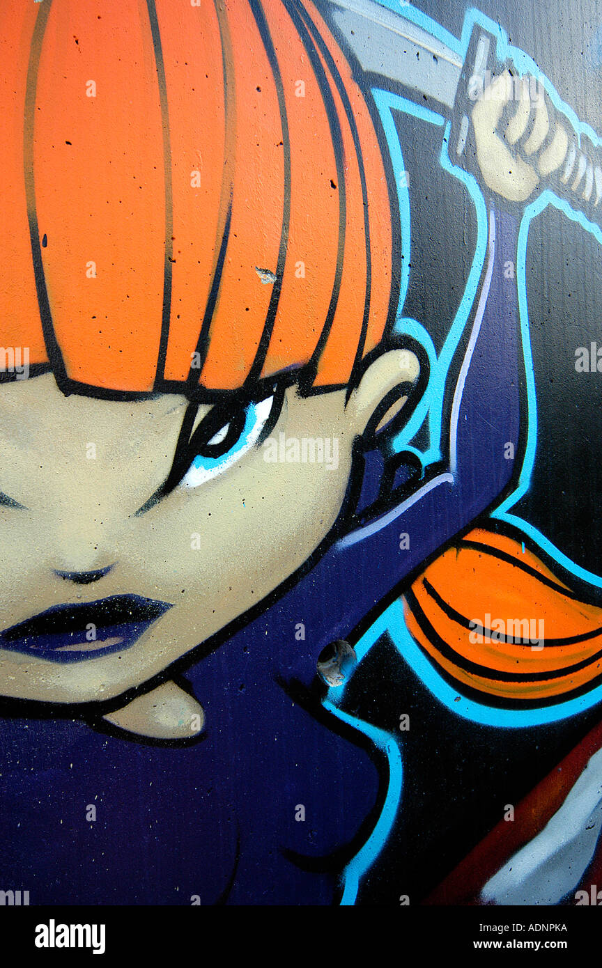 Le Graffiti montre une femme manga sword fighter Banque D'Images