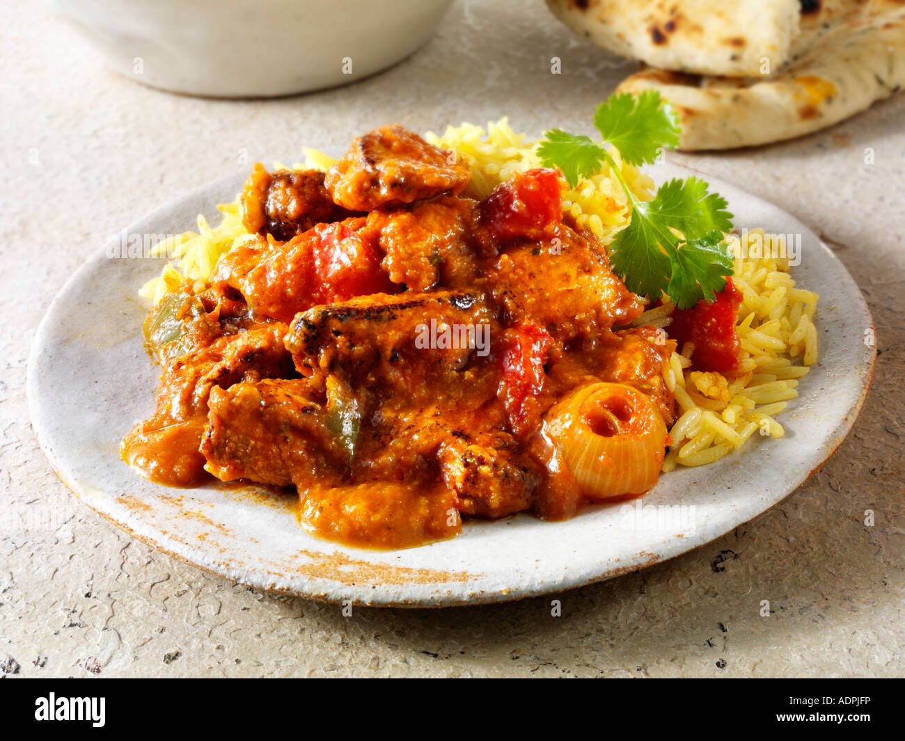 Repas indien - Poulet Jalfrezi avec riz pilaf Banque D'Images