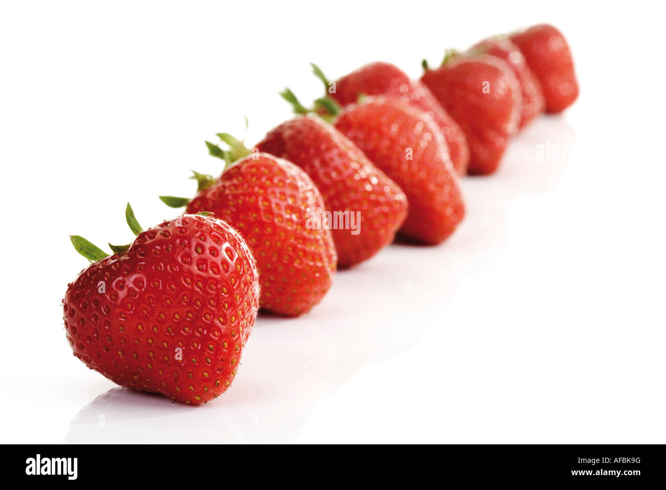 Les fraises dans une rangée, close-up Banque D'Images