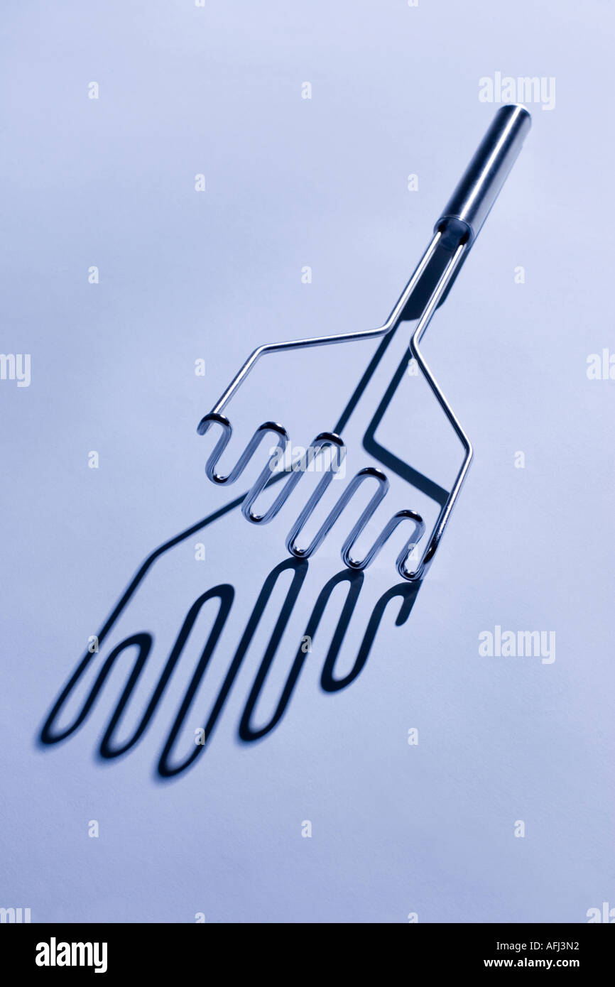 Pilon à pommes de terre studio résumé en acier inoxydable Banque D'Images