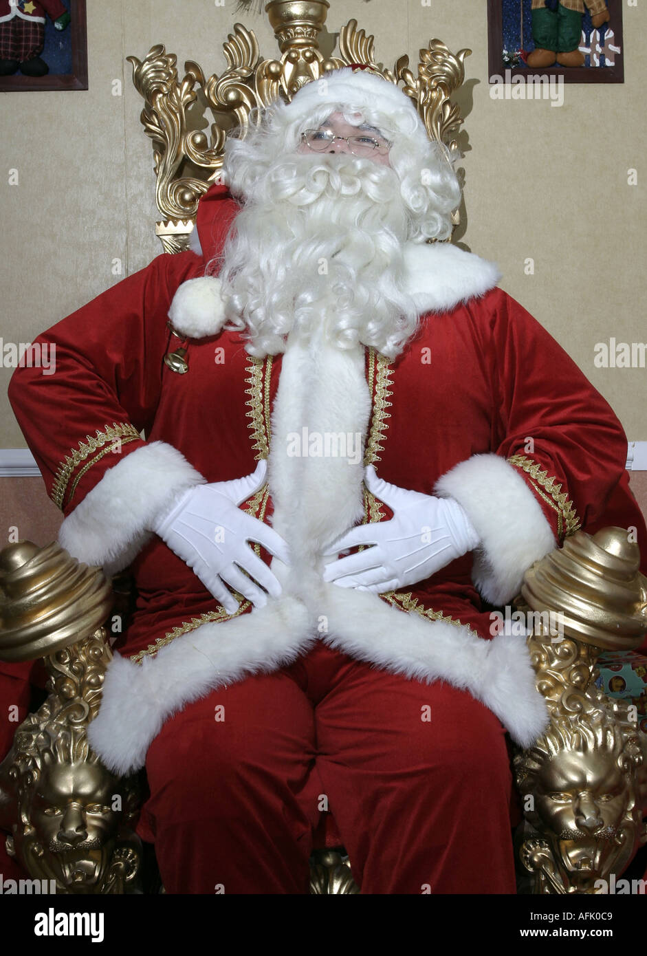Santa Claus rire frottant son ventre Banque D'Images