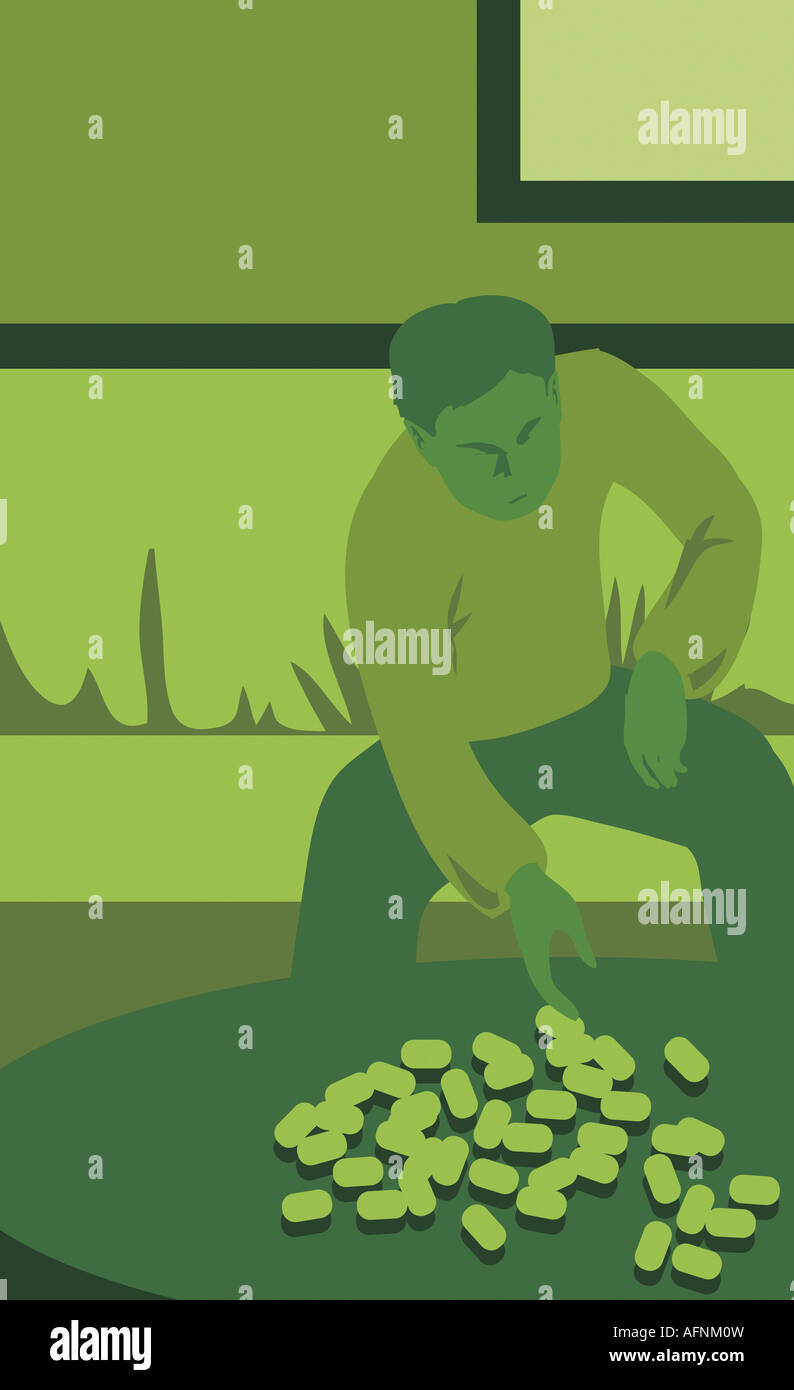 L'homme assis à table et compter des pièces Banque D'Images