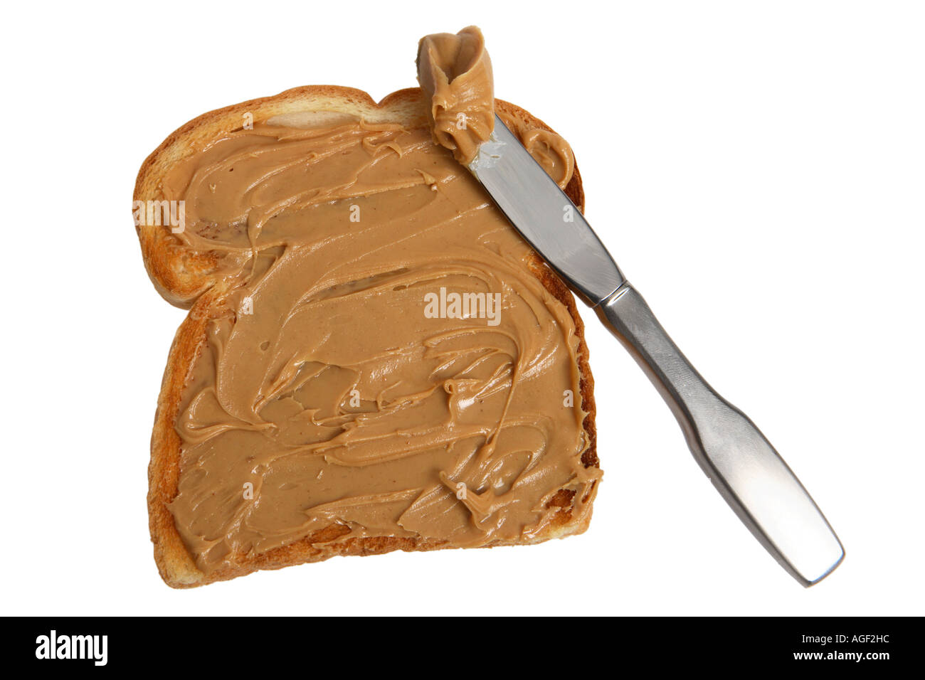 Du pain avec du beurre d'arachide et le couteau Banque D'Images