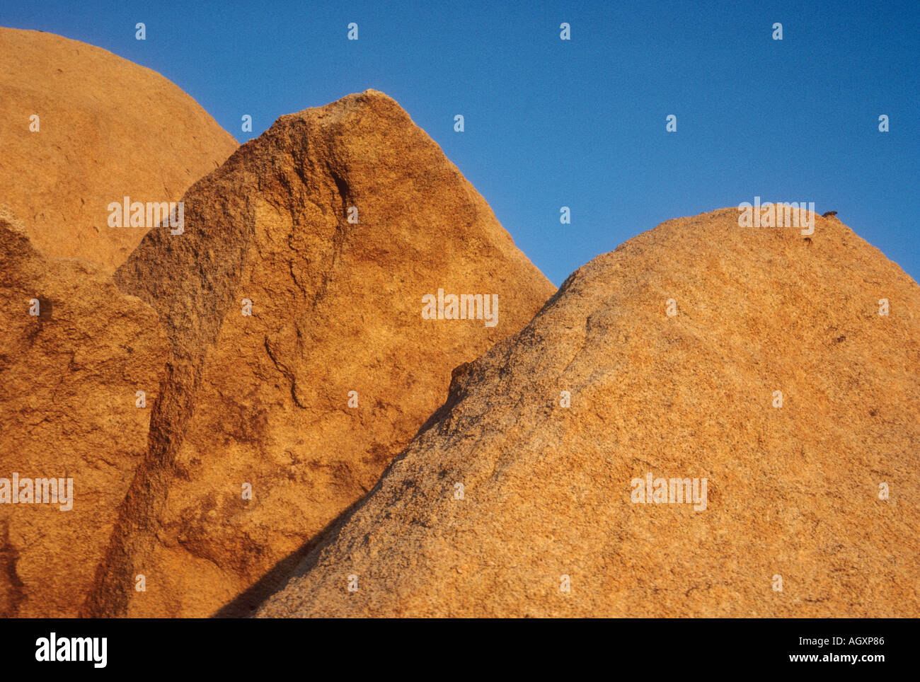 Tors de granit au coucher du soleil Banque D'Images