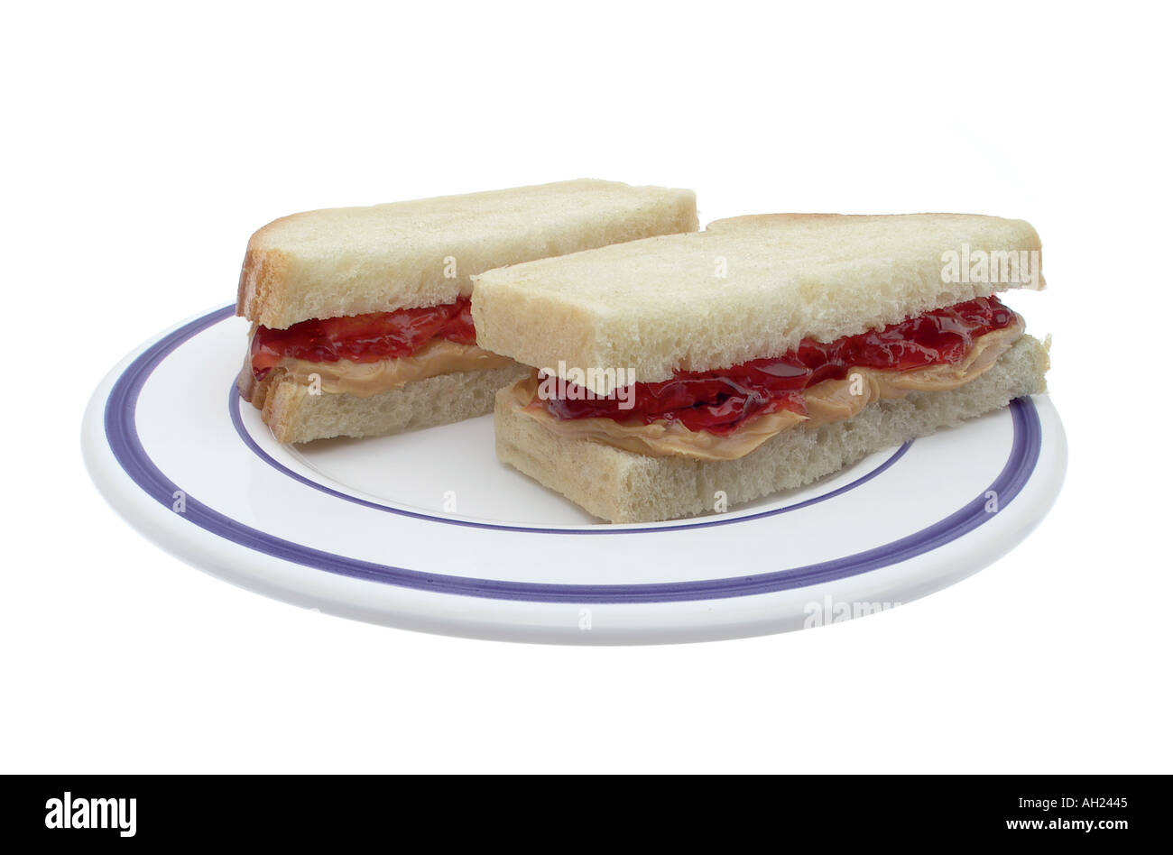 Peanut butter and jelly sandwich se découpant sur fond blanc Banque D'Images