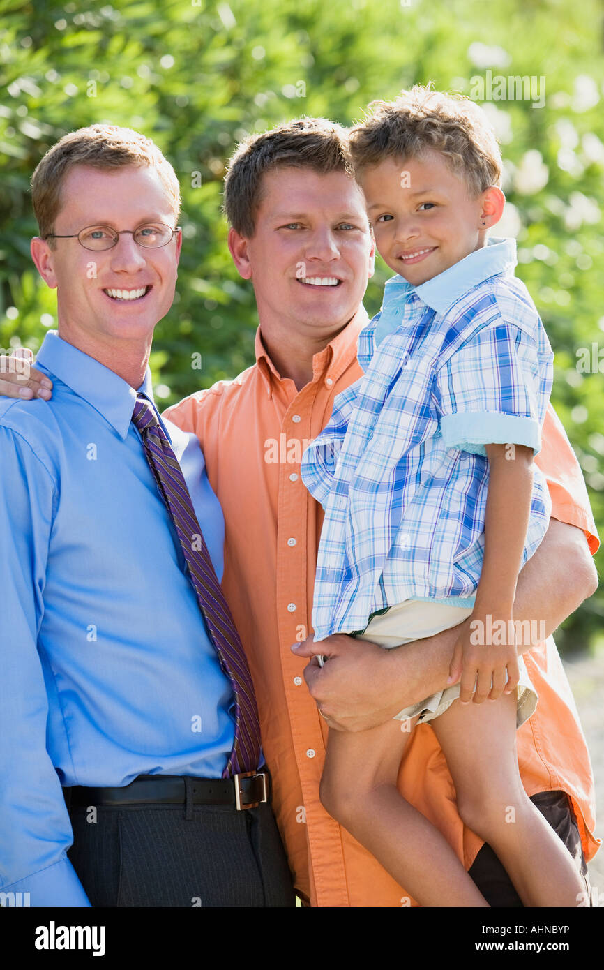 Gay couple smiling with their son Banque D'Images