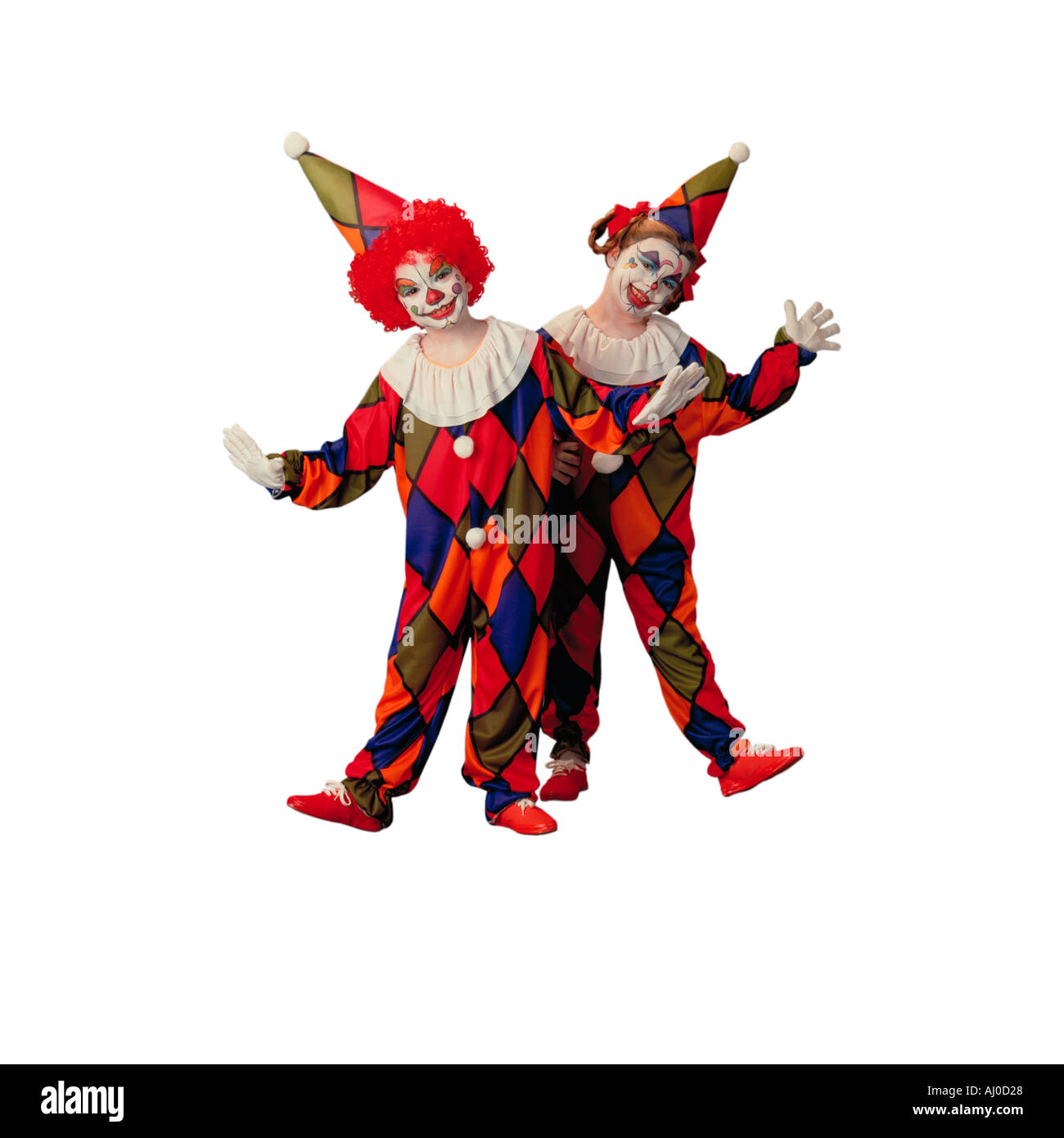 Seamless studio shot of a deux enfants vêtus de costumes traditionnels et le maquillage de clown Banque D'Images