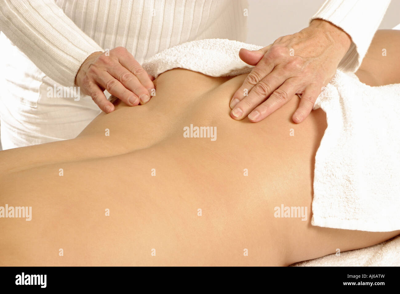 Une autre femme massage femme est de retour Banque D'Images