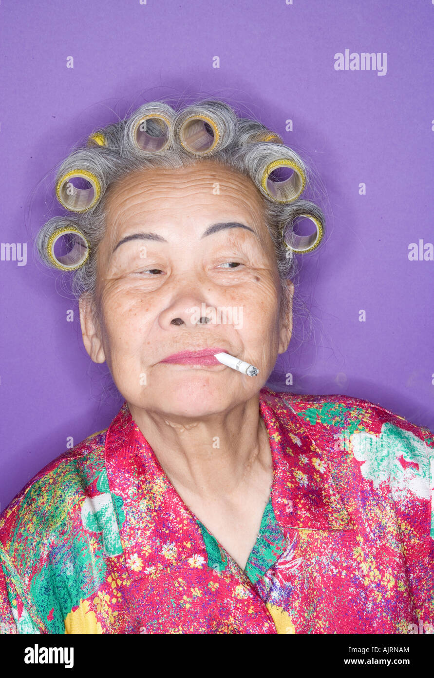 Portrait of senior woman smoking. Banque D'Images