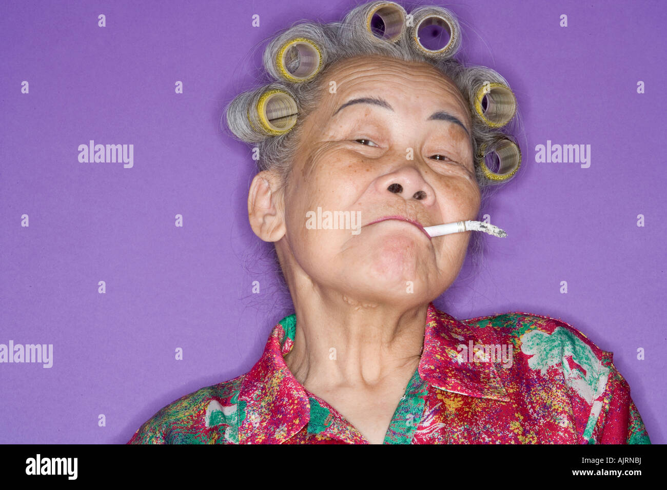 Portrait of senior woman smoking. Banque D'Images