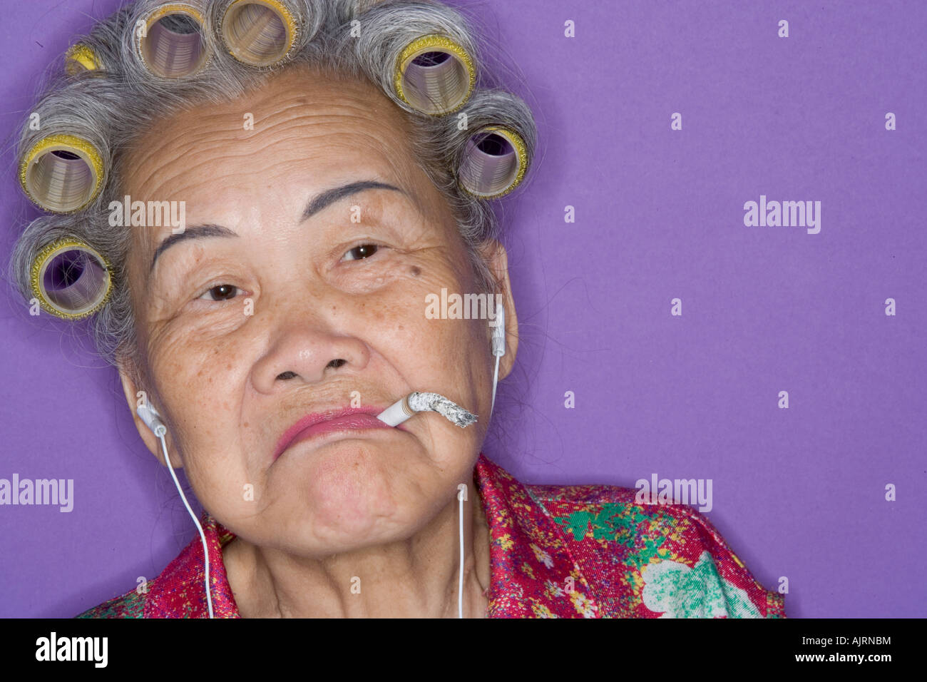 Portrait of senior woman smoking. Banque D'Images