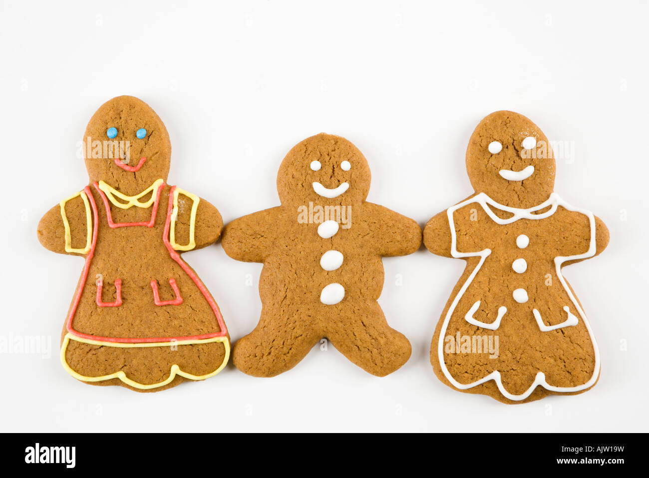 Trois hommes et femmes gingerbread cookies holding hands Banque D'Images