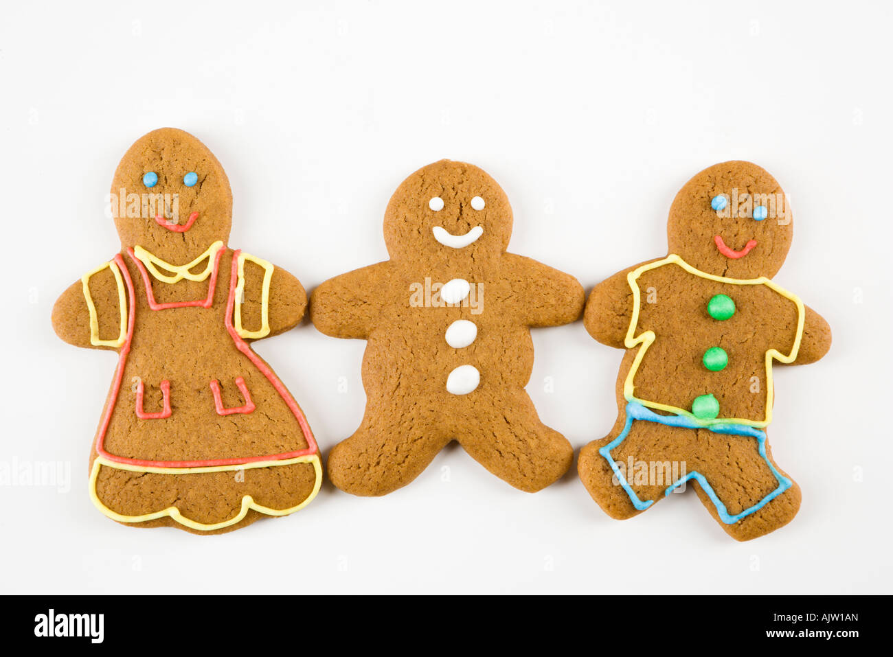 Trois hommes et femmes gingerbread cookies holding hands Banque D'Images