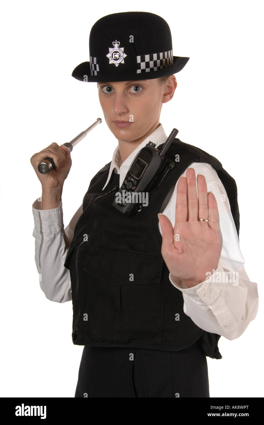 Agent de police en uniforme féminin britannique en position prêt holding baton télescopique métal isolated on white Banque D'Images