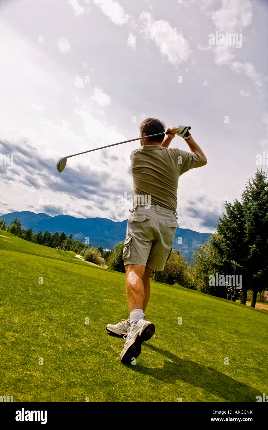 Suite à un tir du golfeur Banque D'Images