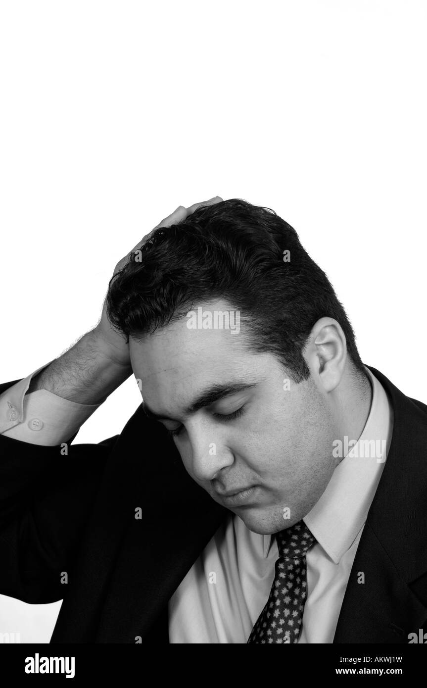 Stressed businessman hand on head Banque D'Images