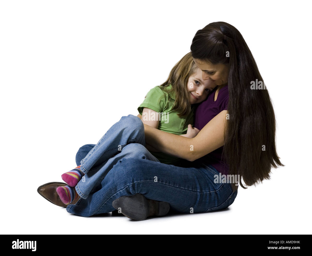 Woman sitting cross legged with girl Banque D'Images